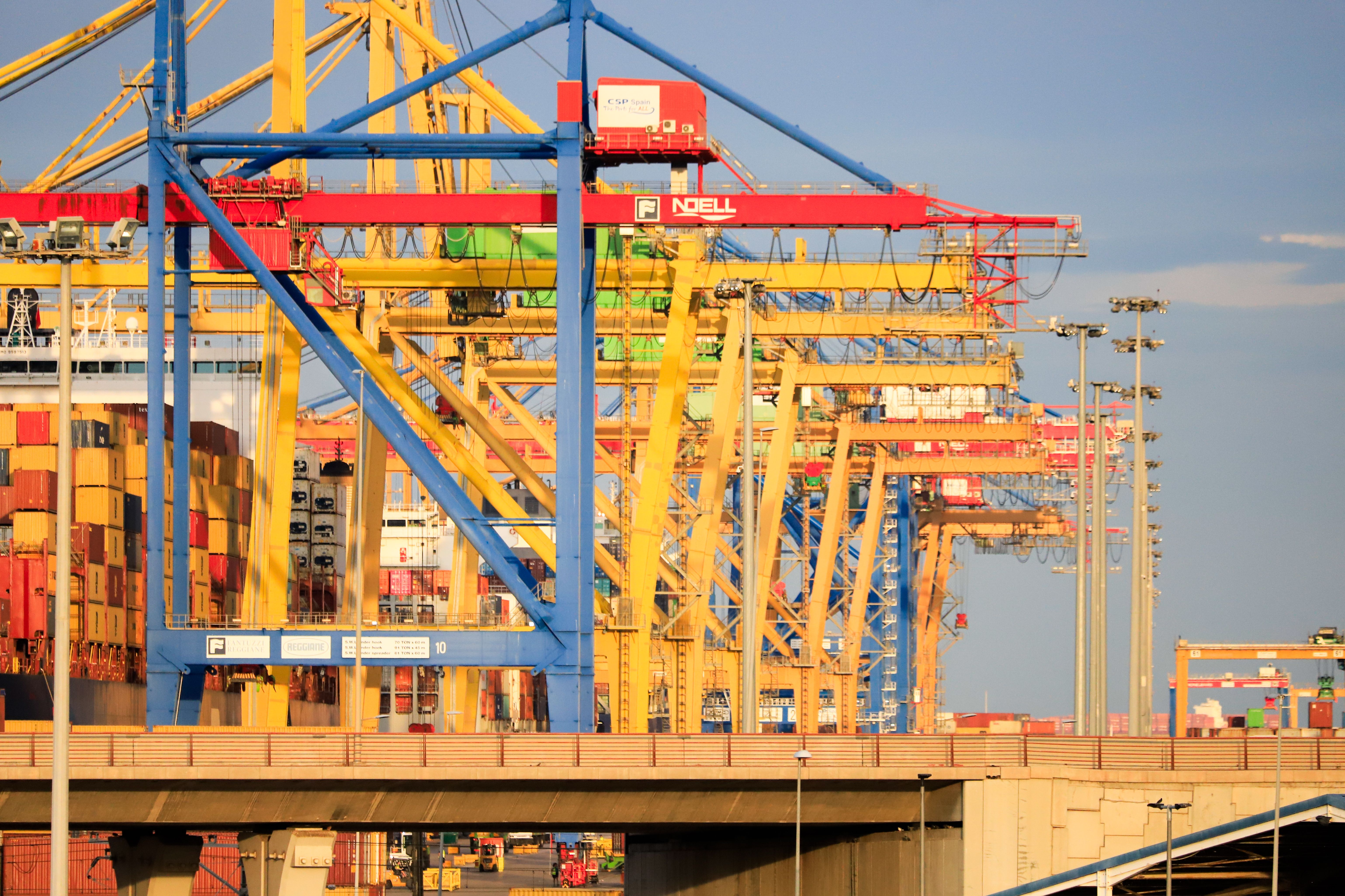 Busy shipping port with container cranes and maritime logistics