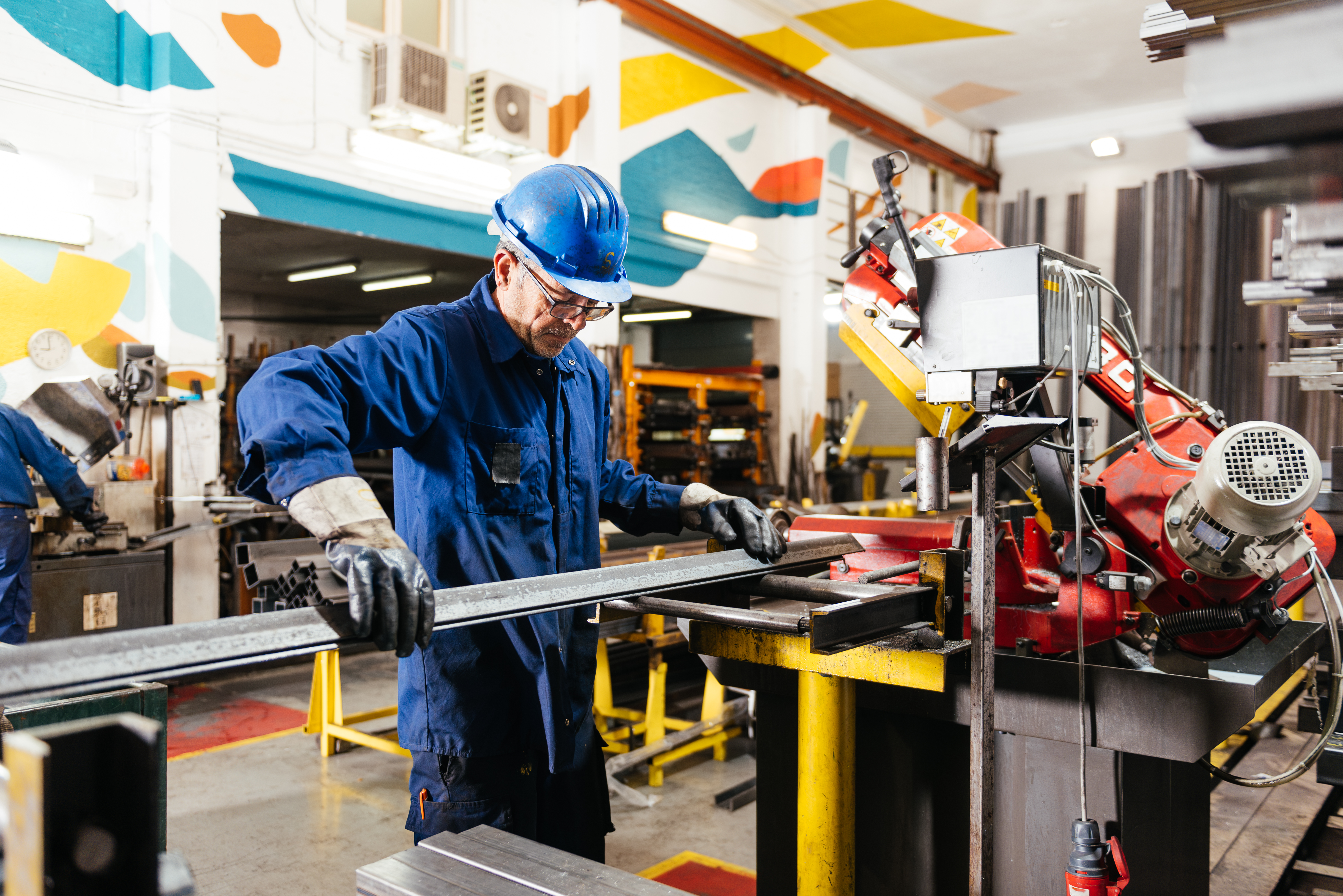Machinist working on the production floor in a factory workshop
